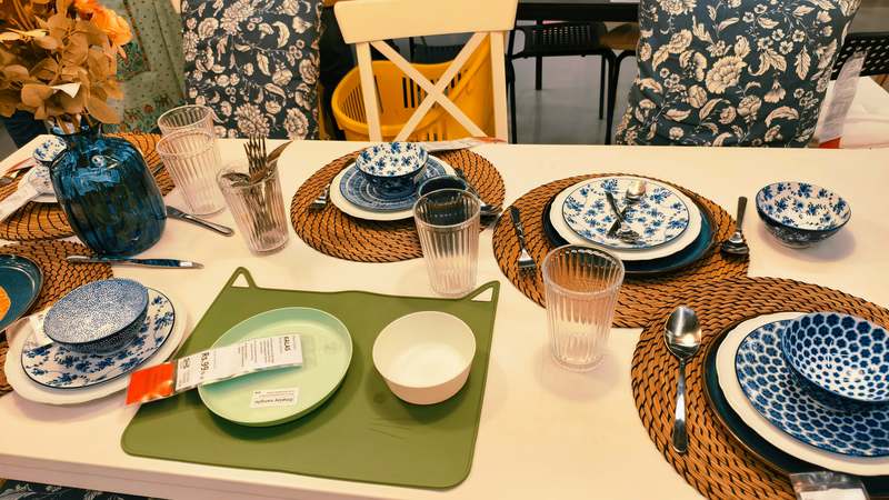 Stylish woven placemats on a rustic wooden dining table with ceramic dishes and soft natural lighting